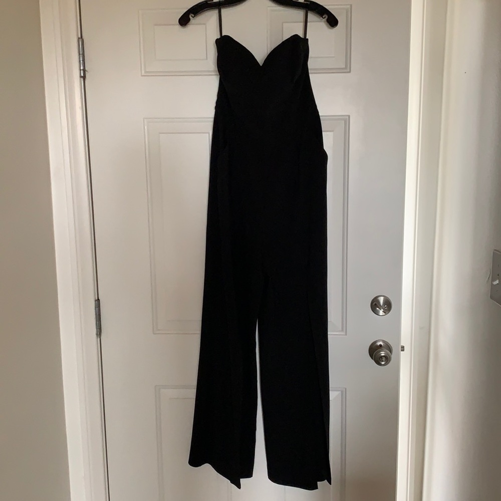 Bebe Black open leg jumpsuit